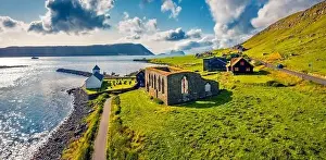 Faroe Island Prints: Panoramic summer view from flying drone of Kirkjubour village with Hestur Island on background