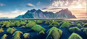 Panoramic view from flying drone of black sand dunes on Stokksnes cape with Vestrahorn (Batman Mountain) on background
