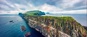 Panoramic view from flying drone of Mykines island with old lighthouse