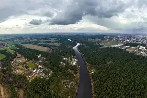 panoramic view from a high altitude of a meandering river in the forest