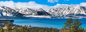 Coniferous Prints: Panoramic view towards Lake Tahoe on a sunny clear day; the snow covered Sierra mountains in the background; evergreen