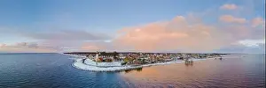 Water Tourism Prints: panoramic view of the Lighthouse of Urk during winter with snow landscape in the Netherlands