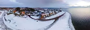 Water Tourism Prints: panoramic view of the Lighthouse of Urk during winter with snow landscape in the Netherlands