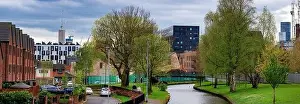 Panoramic view of Manchester Skyline on a spring day from Victoria Mills park, Miles Platting