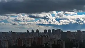 Beautiful Sky Prints: Panoramic view of Moscow's multi-storey buildings covered with the shadow of a storm cloud against the background
