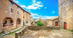 Adriatic Prints: Panoramic view of scenic courtyard with medieval houses in Hum