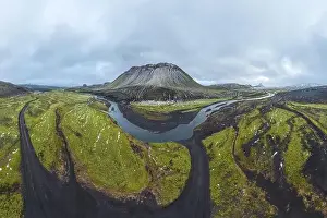 Undisturbed Prints: Panoramic view of winding roads through the green highlands of Iceland with majestic mountains