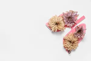 Nicotine Prints: Paper lungs with dried flowers on white background