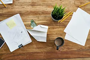 Overhead View Prints: Papers on wooden table in office