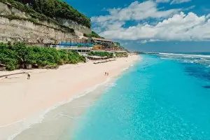 Holiday Beach Prints: Paradise holiday beach with turquoise ocean and beach club in Bali. Aerial view