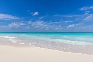 Paradise island beach. Tropical landscape of summer scenery, white sand, blue sea sky. Luxury travel vacation destination. Exotic beach landscape