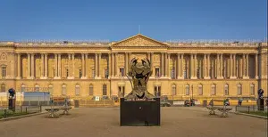 Ideograms Prints: Paris, France - 05 02 2021: View of the open-air exhibition of bronze faces statues at sunrise