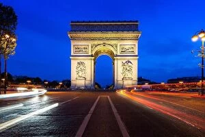 Images Dated 7th May 2016: Paris street at night with the Arc de Triomphe in Paris, France