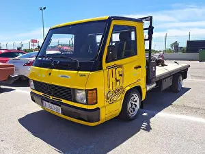 Modified Prints: A parked old yellow Mercedes Benz MB100 truck