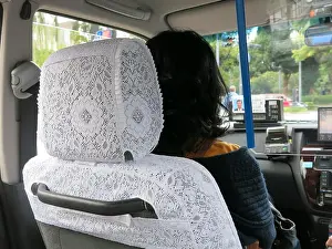 Cleanliness Prints: Passenger in the front seat of a Tokyo taxi