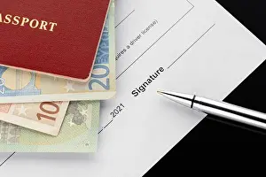 Driver License Prints: Passport with euro banknotes, document signing