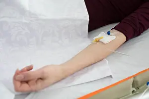 Only Women Prints: patient having IV drip and lying at hospital ward. Illness