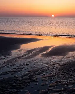 Beach Scene Prints: pattern in sand and colorful reflection of setting sun in water