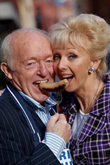 Elderly Prints: Paul Daniels and his wife Debbie McGee judge the North West stage of British Sausage Week in Manchester UK