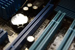 Capacitor Prints: A PC motherboard's PCI-E slots and battery