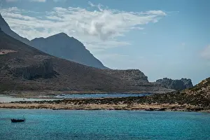 Turquoise Waters Prints: A peaceful view of Gramvousa's turquoise waters with the rugged Cretan mountains in the background