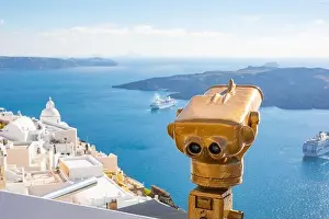 Peaceful view in Santorini, Greece with white architecture and flowers, cruise ships, Mediterranean summer mood, vacation and travel background