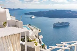 Peaceful view in Santorini, Greece with white architecture and flowers, cruise ships, Mediterranean summer mood, vacation and travel background