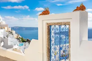 Peaceful view in Santorini, Greece with white architecture and flowers, cruise ships, Mediterranean summer mood, vacation and travel background