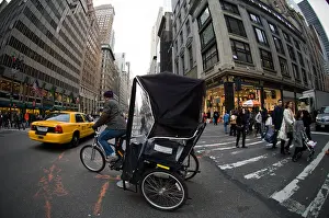 Regulations Prints: A pedicab turns onto Fifth Avenue in New York on Black Friday