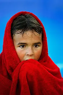Released Prints: People 8 year old child wrapped in red towel after swimming Model released South Africa