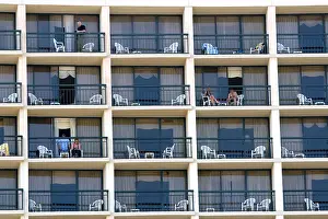 Gulf Coast Prints: People on balconies of hotel rooms at Galveston Beach in Galveston Texas