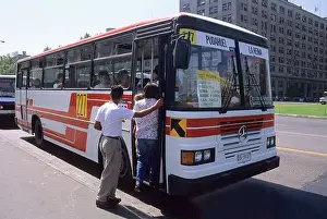 People boarding a bus in Santiago Chile