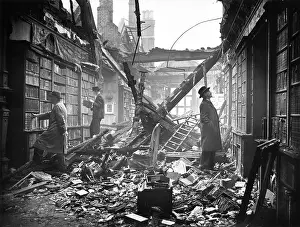 Cities Prints: People browing the shelves in the heavily damaged Holland House library in Kensington