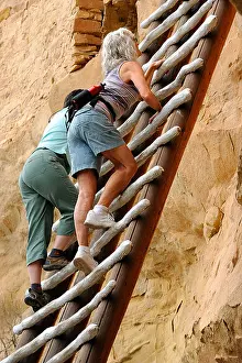 Floors Prints: People climbing a wood ladder along a dwelling of Balcony House
