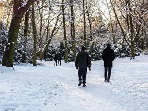 Mitte Prints: People enjoy walking in snowy landscape after heavy winter snow in Public Park