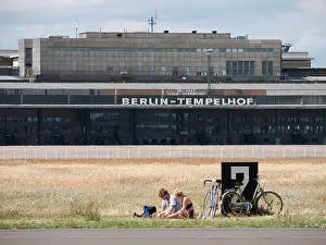 German Culture Prints: People having picnic next to runway at new city public Tempelhofer Park on site of former Tempelhof Airport in Berlin