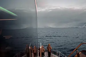 Brim Prints: People looking out over the arctic ocean from the front of tour boat, Norway