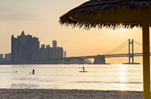 Highrise Prints: People paddleboarding at Gwangalli Beach at sunrise, Busan, South Korea