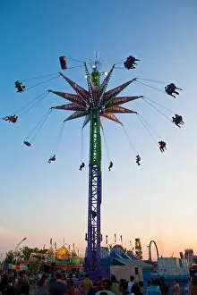 Thrill Prints: People on a ride at sunset at the Canadian National Exhibition