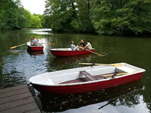 Rowing Boat Prints: People rowing boats in lake at Tiergarten park in Berlin Germany