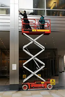 Scissor Prints: People on scissor lift cleaning City of London UK