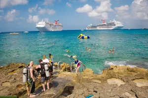 Grand Cayman Prints: People scuba diving and snokeling with cruise ships in background off Georgetown on Grand Cayman in the Cayman Islnads