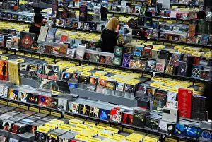 Customers Prints: People search for their favorite music artists albums in Amoeba Music