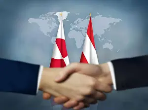 Handshake Prints: Two people shaking hands in front of Austria and Greenland flags