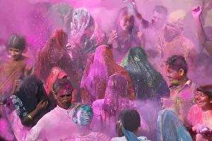 Folk Culture Prints: People throwing color powder and color water onto each other at Holi Festival India