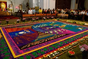 Guatemala Prints: People view carpets made for Semana Santa in the Iglesia de San Francisco in Antigua Guatemala March 22 2005