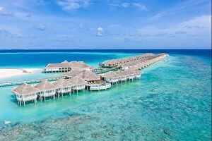 Images Dated 5th August 2019: Perfect aerial landscape, luxury tropical resort or hotel with water villas