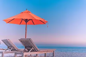 Perfect beach banner, two sun chairs and umbrella in tropical landscape. Tranquil exotic nature scenery. Luxury resort for summer vacation and holiday