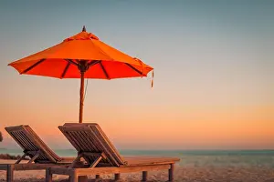 Perfect beach banner, two sun chairs and umbrella in tropical landscape. Tranquil exotic nature scenery. Luxury resort for summer vacation and holiday