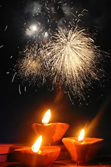 Lamps Prints: A perfect image showing the celebration of Diwali festival with traditional lamps and fireworks in the background